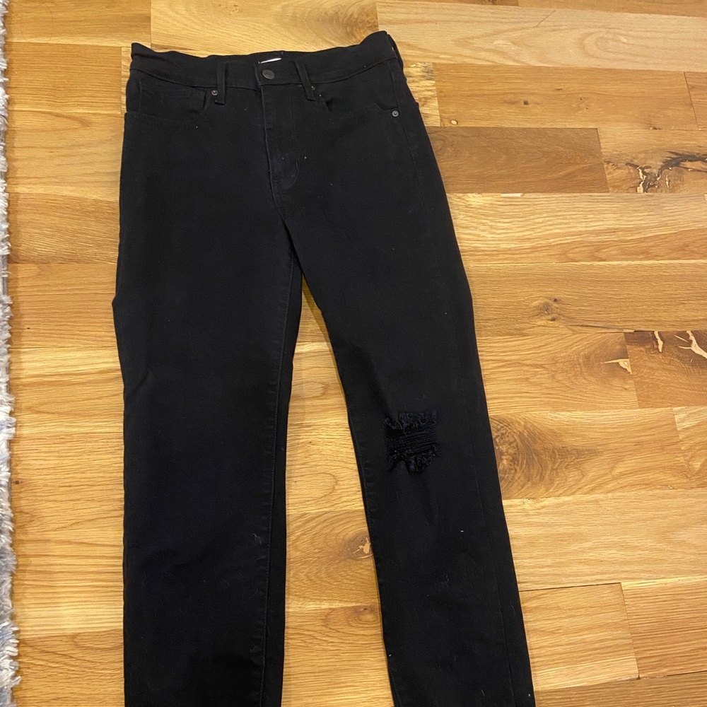 Black Levi’s high rise ripped and slightly cropped